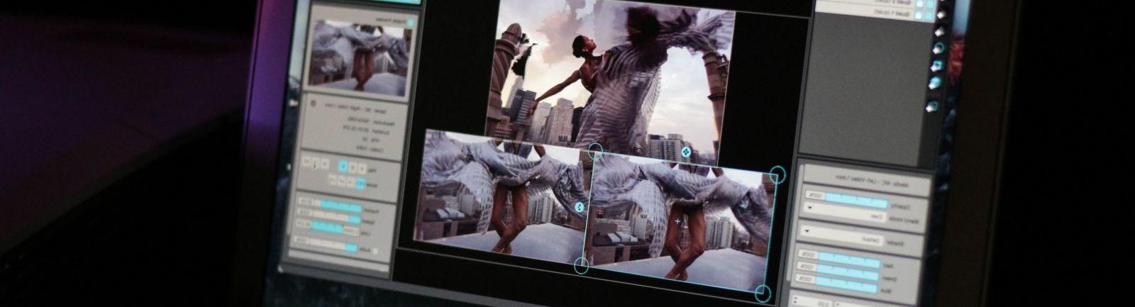 电脑显示器上正在显示一个女人跳舞的剪辑画面.